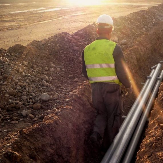 Contractors install conduit lines at Kirkuk Regional Air Base, Iraq, as part of a foreign military sales effort being managed by the Electronic Systems Center's 853rd Electronic Systems Group at Hanscom Air Force Base, Mass. (Courtesy photo)